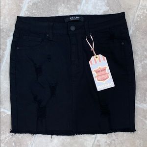 Selling a black distressed skirt.